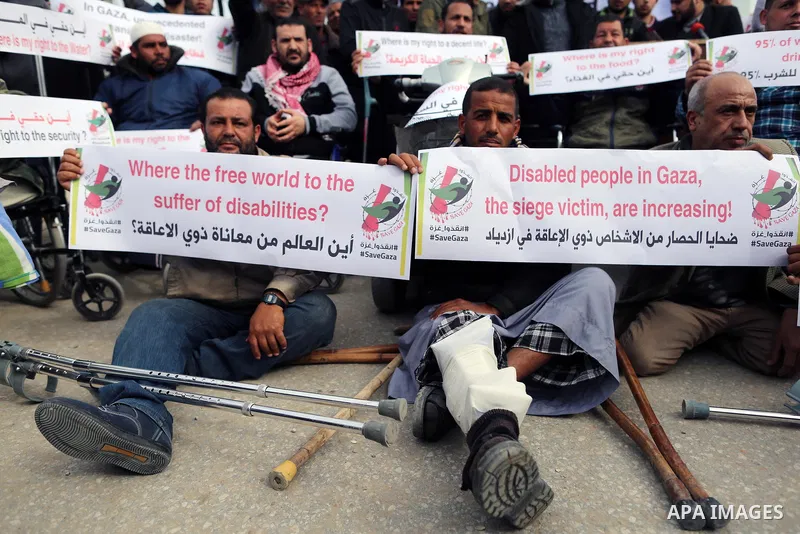 Wounded and disabled Palestinians take part in a protest against the siege on the Gaza Strip, at Erez crossing, in the northern Gaza Strip, on February 8, 2018. Israel has maintained a siege on Gaza for a decade which it...