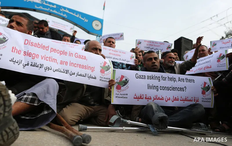 Wounded and disabled Palestinians take part in a protest against the siege on the Gaza Strip, at Erez crossing, in the northern Gaza Strip, on February 8, 2018. Israel has maintained a siege on Gaza for a decade which it...