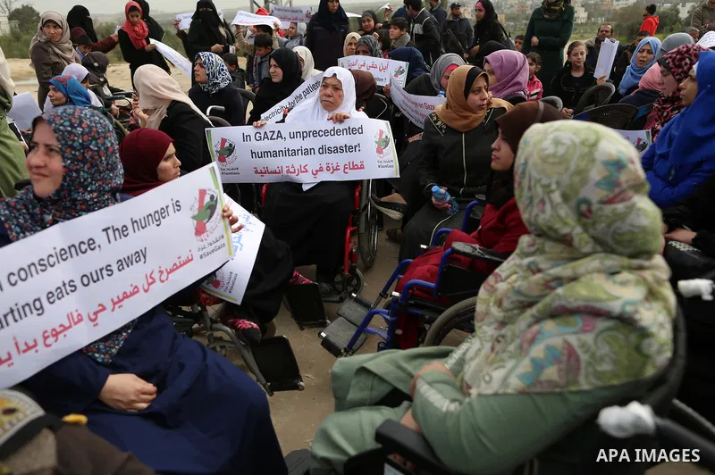 Wounded and disabled Palestinians take part in a protest against the siege on the Gaza Strip, at Erez crossing, in the northern Gaza Strip, on February 8, 2018. Israel has maintained a siege on Gaza for a decade which it...