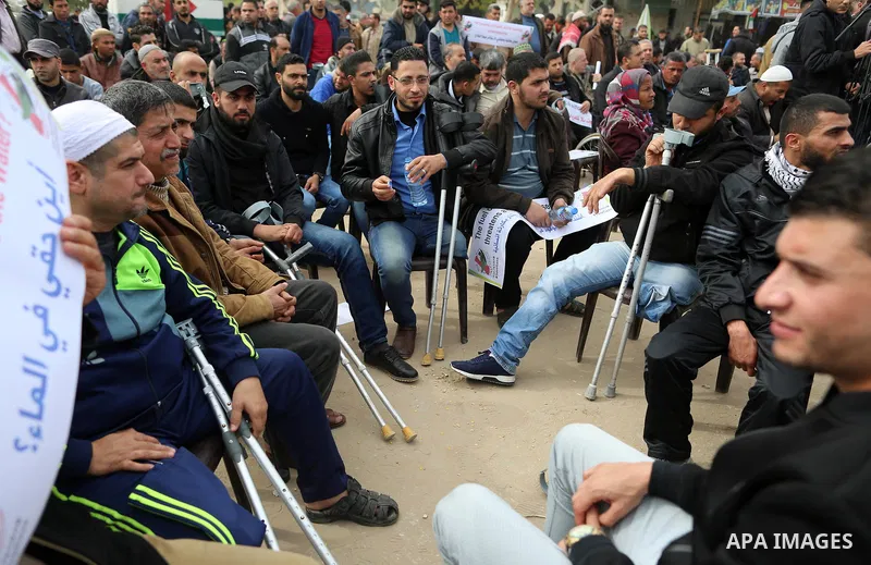 Wounded and disabled Palestinians take part in a protest against the siege on the Gaza Strip, at Erez crossing, in the northern Gaza Strip, on February 8, 2018. Israel has maintained a siege on Gaza for a decade which it...