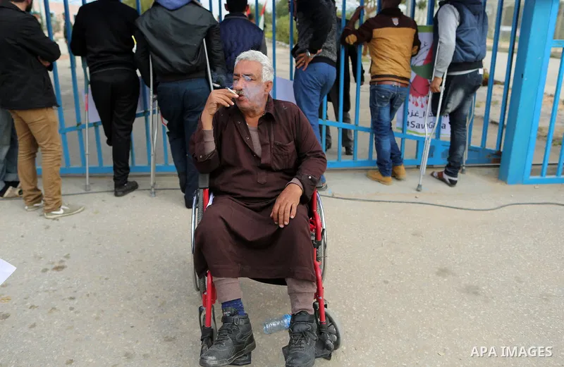 Wounded and disabled Palestinians take part in a protest against the siege on the Gaza Strip, at Erez crossing, in the northern Gaza Strip, on February 8, 2018. Israel has maintained a siege on Gaza for a decade which it...