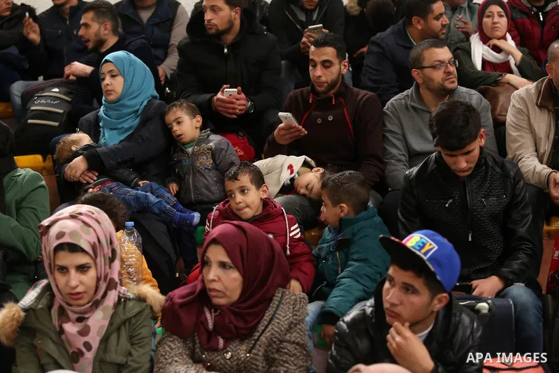 Palestinians wait for travel permits to cross into Egypt through the Rafah border crossing after it was opened by Egyptian authorities for humanitarian cases on the first time in 2018, in the southern Gaza Strip on Febru...
