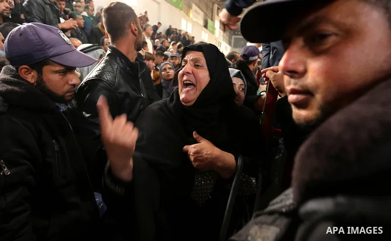 Palestinians wait for travel permits to cross into Egypt through the Rafah border crossing after it was opened by Egyptian authorities for humanitarian cases on the first time in 2018, in the southern Gaza Strip on Febru...