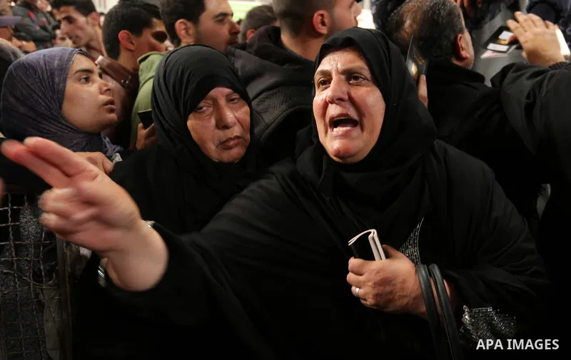 Palestinians wait for travel permits to cross into Egypt through the Rafah border crossing after it was opened by Egyptian authorities for humanitarian cases on the first time in 2018, in the southern Gaza Strip on Febru...