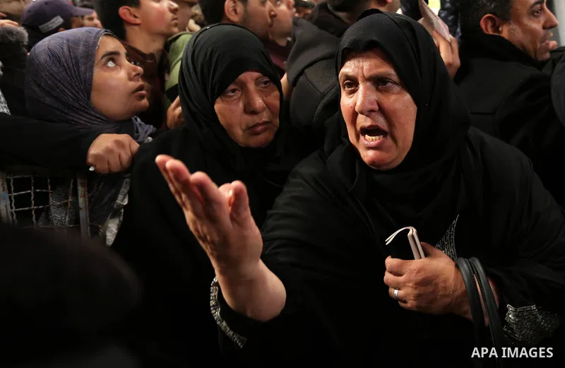 Palestinians wait for travel permits to cross into Egypt through the Rafah border crossing after it was opened by Egyptian authorities for humanitarian cases on the first time in 2018, in the southern Gaza Strip on Febru...