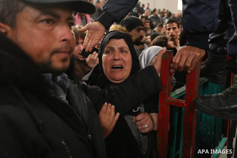 Palestinians wait for travel permits to cross into Egypt through the Rafah border crossing after it was opened by Egyptian authorities for humanitarian cases on the first time in 2018, in the southern Gaza Strip on Febru...