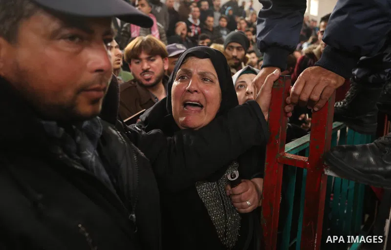 Palestinians wait for travel permits to cross into Egypt through the Rafah border crossing after it was opened by Egyptian authorities for humanitarian cases on the first time in 2018, in the southern Gaza Strip on Febru...
