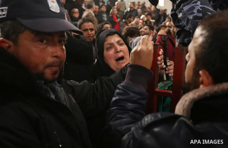 Palestinians wait for travel permits to cross into Egypt through the Rafah border crossing after it was opened by Egyptian authorities for humanitarian cases on the first time in 2018, in the southern Gaza Strip on Febru...