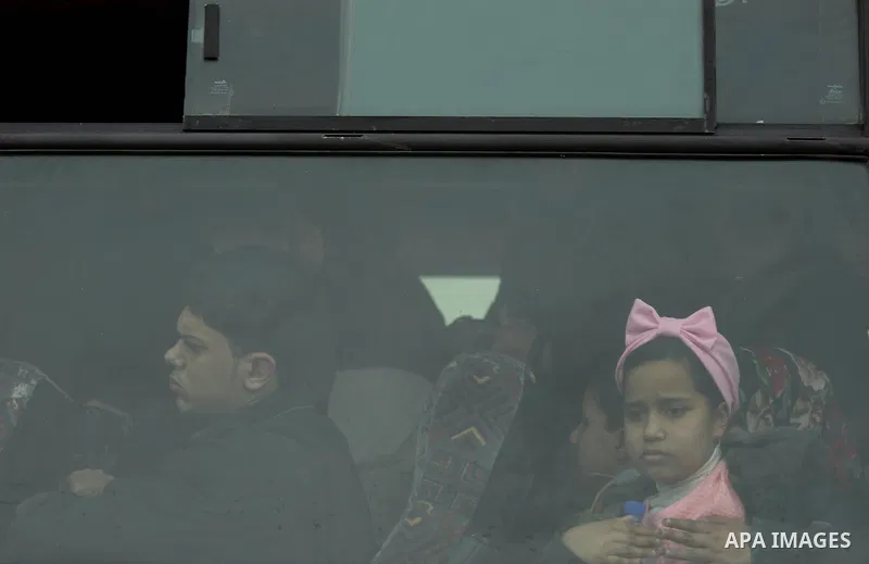 Palestinians wait for travel permits to cross into Egypt through the Rafah border crossing after it was opened by Egyptian authorities for humanitarian cases on the first time in 2018, in the southern Gaza Strip on Febru...