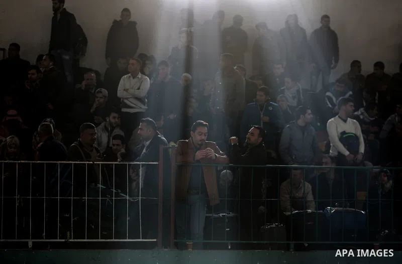 Palestinians wait for travel permits to cross into Egypt through the Rafah border crossing after it was opened by Egyptian authorities for humanitarian cases on the first time in 2018, in the southern Gaza Strip on Febru...