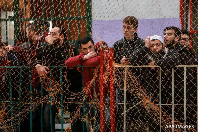 Palestinians wait for travel permits to cross into Egypt through the Rafah border crossing after it was opened by Egyptian authorities for humanitarian cases on the first time in 2018, in the southern Gaza Strip on Febru...