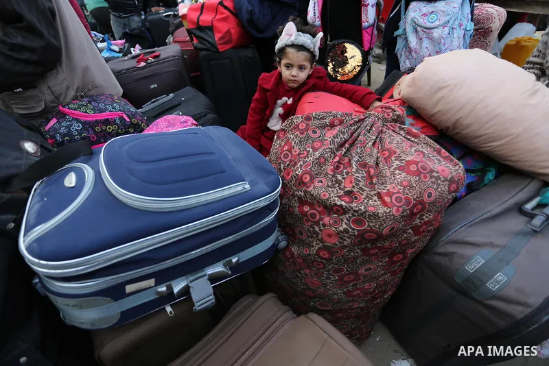 Palestinians wait to cross into Egypt through the Rafah border crossing after it was opened by Egyptian authorities for humanitarian cases, in the southern Gaza Strip, on February 09, 2018. Photo by Ashraf Amra