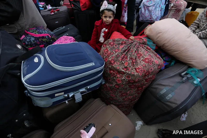Palestinians wait to cross into Egypt through the Rafah border crossing after it was opened by Egyptian authorities for humanitarian cases, in the southern Gaza Strip, on February 09, 2018. Photo by Ashraf Amra