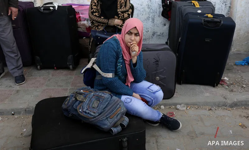Palestinians wait to cross into Egypt through the Rafah border crossing after it was opened by Egyptian authorities for humanitarian cases, in the southern Gaza Strip, on February 09, 2018. Photo by Ashraf Amra