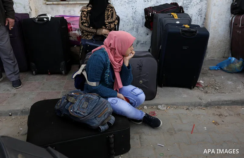 Palestinians wait to cross into Egypt through the Rafah border crossing after it was opened by Egyptian authorities for humanitarian cases, in the southern Gaza Strip, on February 09, 2018. Photo by Ashraf Amra