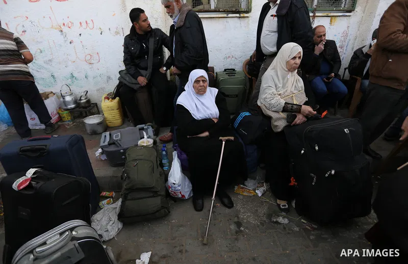 Palestinians wait to cross into Egypt through the Rafah border crossing after it was opened by Egyptian authorities for humanitarian cases, in the southern Gaza Strip, on February 09, 2018. Photo by Ashraf Amra