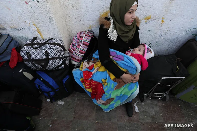 Palestinians wait to cross into Egypt through the Rafah border crossing after it was opened by Egyptian authorities for humanitarian cases, in the southern Gaza Strip, on February 09, 2018. Photo by Ashraf Amra