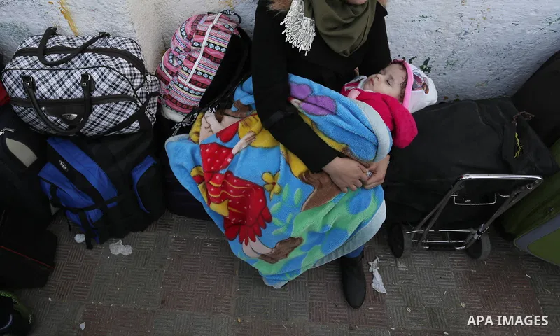 Palestinians wait to cross into Egypt through the Rafah border crossing after it was opened by Egyptian authorities for humanitarian cases, in the southern Gaza Strip, on February 09, 2018. Photo by Ashraf Amra