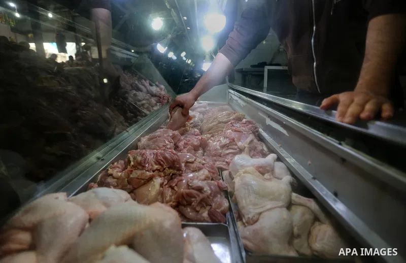 A Palestinian vendor sells chicken at a market in Gaza city on February 8, 2018. Last two days, chicken prices in Gaza strip soared to a record high, to reach to 5$ per 1 Kg. The ongoing economic crisis in the Gaza Strip...