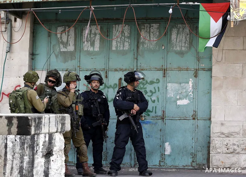 Israeli security froces take position during clashes with Palestinian protesters as demonstrations continue over US President Donald Trump's declaration of Jerusalem as Israel's capital, in the West Bank city of Hebron o...