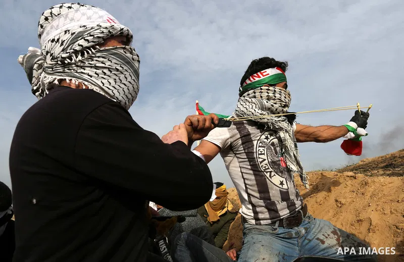 Palestinian protesters clash with Israeli security forces as demonstrations continue over US President Donald Trump's declaration of Jerusalem as Israel's capital near the border with Israel in the southern Gaza Strip Fe...