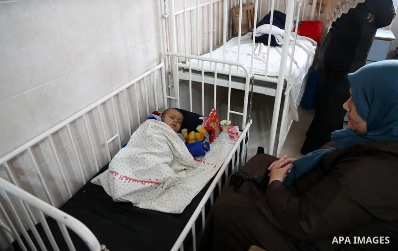 A child is seen in Dora hospital in Gaza City after it stopped its services on February 11, 2018 after it ran out of fuel. Seven medical centers in Gaza have stopped services due to lack of fuel to power generators. Ashr...