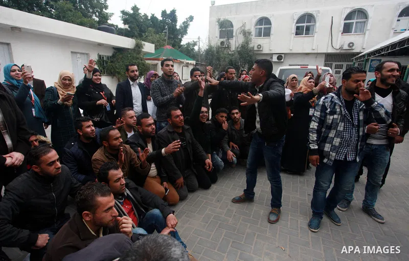 Palestinian graduates take part during a protest to demand their rights, inside Ministry of Labor headquarters in Gaza city on February 11, 2018. Photo by Mahmoud Ajour