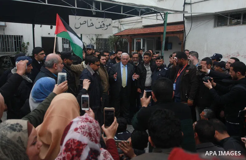 Palestinian Minister of work Mamoun Abu Shahla speaks to graduates during a protest to demand their rights, inside Ministry of Labor headquarters in Gaza city on February 11, 2018. Photo by Mahmoud Ajour