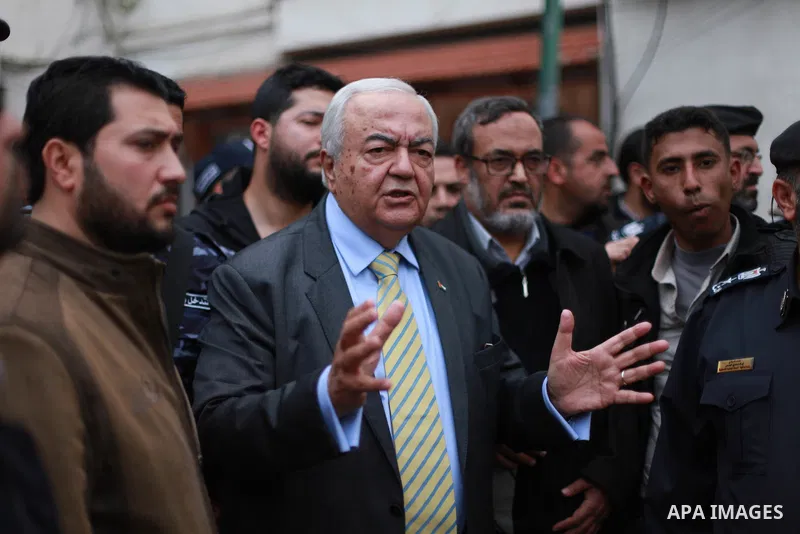 Palestinian Minister of work Mamoun Abu Shahla speaks to graduates during a protest to demand their rights, inside Ministry of Labor headquarters in Gaza city on February 11, 2018. Photo by Mahmoud Ajour
