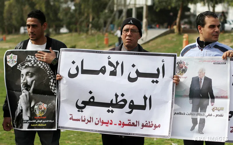 The Palestinian Authority employees in the Gaza Strip take part in a protest demanding their right after Palestinian Authority force them into early retirement in Gaza city on February 12, 2018. Photo by Mahmoud Ajour