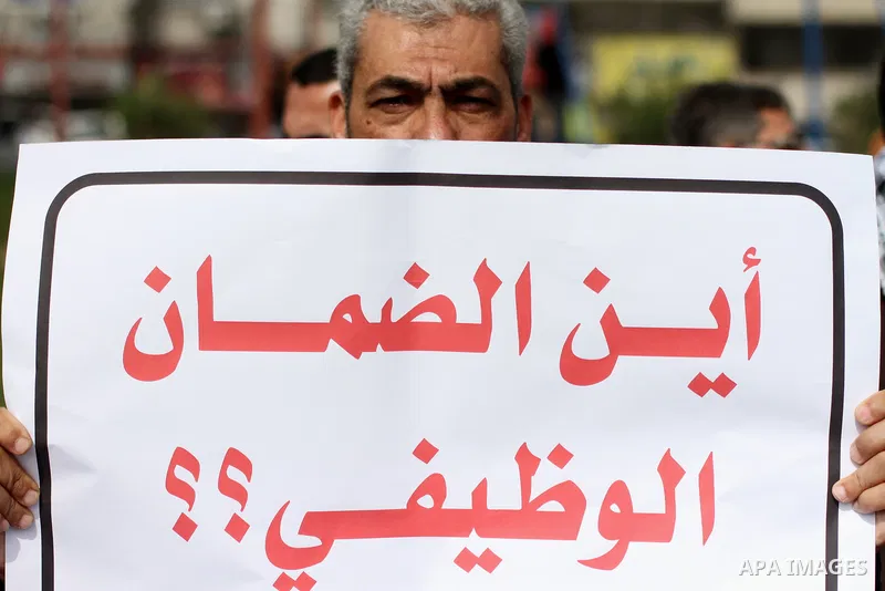The Palestinian Authority employees in the Gaza Strip take part in a protest demanding their right after Palestinian Authority force them into early retirement in Gaza city on February 12, 2018. Photo by Mahmoud Ajour