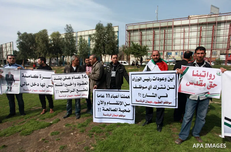 The Palestinian Authority employees in the Gaza Strip take part in a protest demanding their right after Palestinian Authority force them into early retirement in Gaza city on February 12, 2018. Photo by Mahmoud Ajour