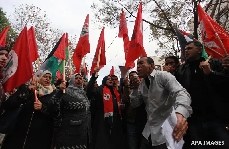Palestinian supporters of Palestinian People's Party take part in a protest against U.S. decision to cut aid, in front of the headquarter United Nation "UNSCO", in Gaza city on February 12, 2018. Photo by Mahmoud Ajour