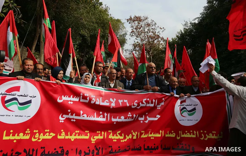 Palestinian supporters of Palestinian People's Party take part in a protest against U.S. decision to cut aid, in front of the headquarter United Nation "UNSCO", in Gaza city on February 12, 2018. Photo by Ramadan El-agha