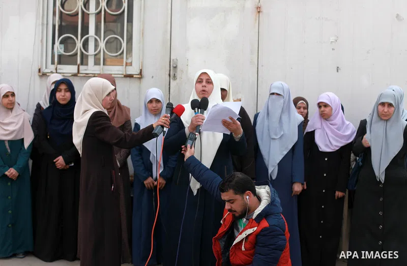 Palestinian women take part in a press conference over Israeli blockade on Gaza strip, in front of United Nations Development Programme office (UNDP), in Gaza City on February 12, 2018. Photo by Mahmoud Ajour