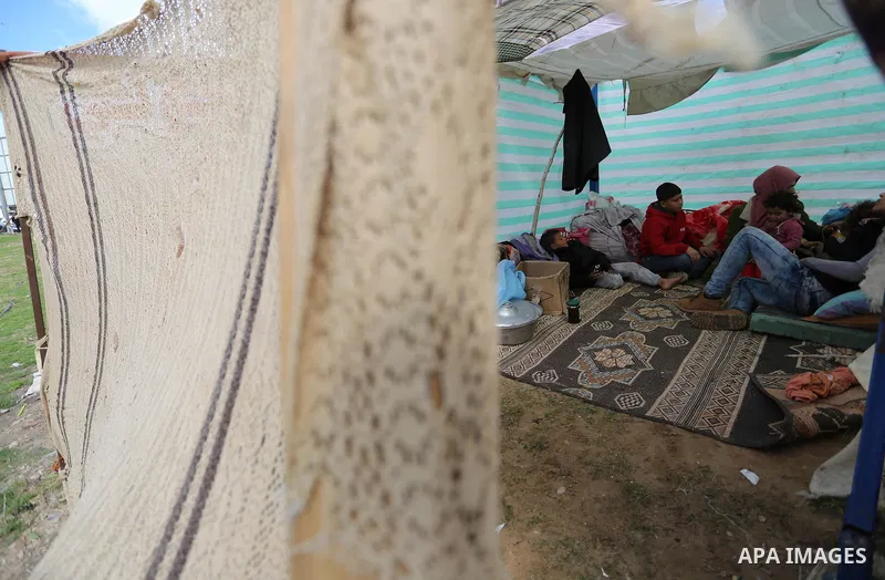 The Palestinian family of Fadel al-Deree gathering around their tent in the middle of Gaza City, on February 13, 2017. The 55-year-old Fadel, his wife and their eight children left their apartment, where they lived for t...