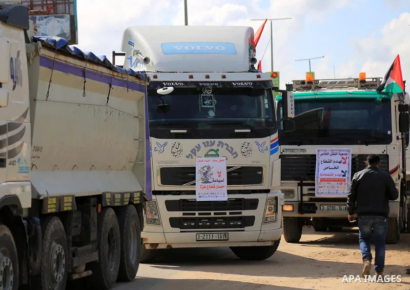 Palestinian truck drivers take part in a protest against the siege on the Gaza Strip, at Erez crossing, in the northern Gaza Strip on February 14, 2018. Israel has maintained a siege on Gaza for a decade which it says is...