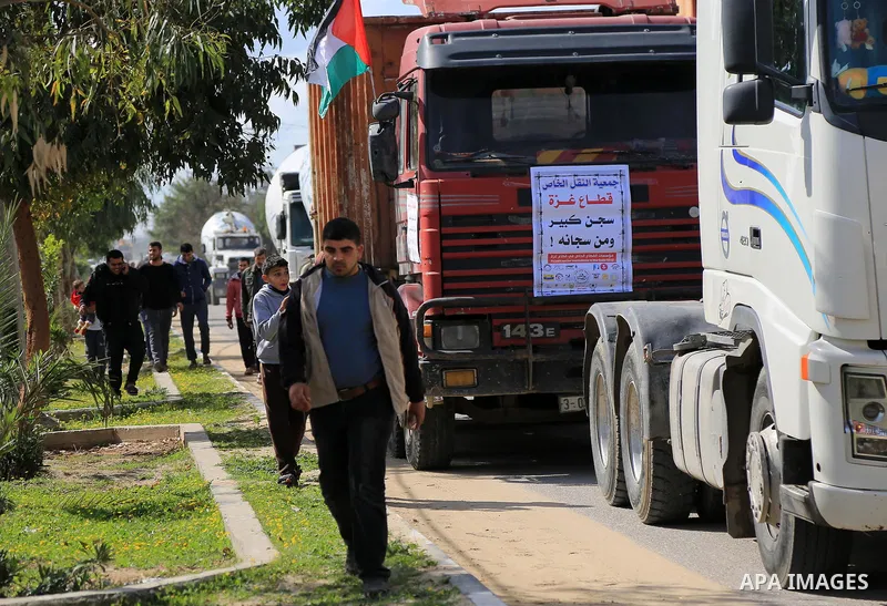 Palestinian truck drivers take part in a protest against the siege on the Gaza Strip, at Erez crossing, in the northern Gaza Strip on February 14, 2018. Israel has maintained a siege on Gaza for a decade which it says is...
