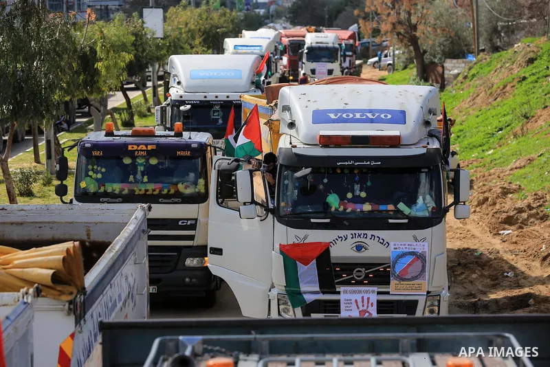 Palestinian truck drivers take part in a protest against the siege on the Gaza Strip, at Erez crossing, in the northern Gaza Strip on February 14, 2018. Israel has maintained a siege on Gaza for a decade which it says is...