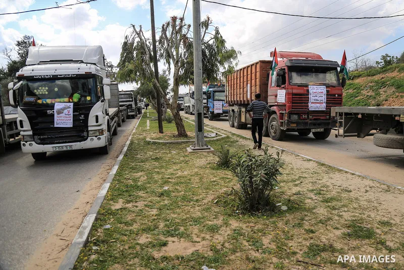 Palestinian truck drivers take part in a protest against the siege on the Gaza Strip, at Erez crossing, in the northern Gaza Strip on February 14, 2018. Israel has maintained a siege on Gaza for a decade which it says is...