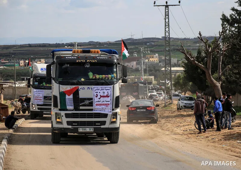 Palestinian truck drivers take part in a protest against the siege on the Gaza Strip, at Erez crossing, in the northern Gaza Strip on February 14, 2018. Israel has maintained a siege on Gaza for a decade which it says is...