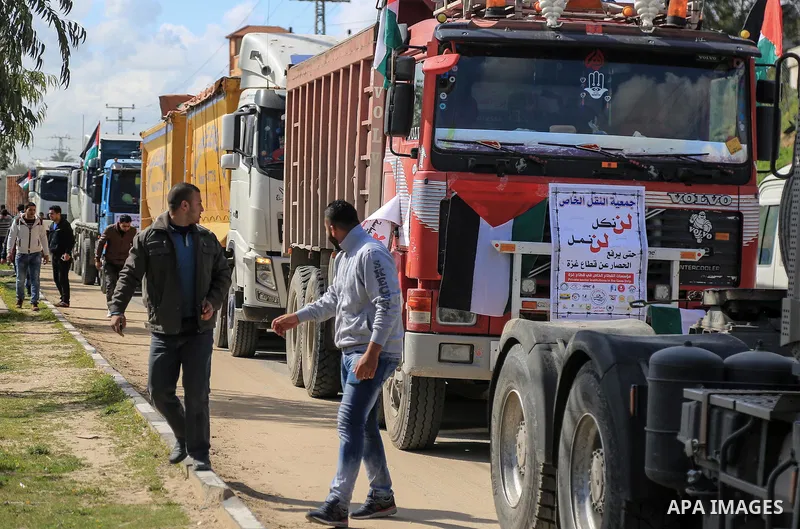 Palestinian truck drivers take part in a protest against the siege on the Gaza Strip, at Erez crossing, in the northern Gaza Strip on February 14, 2018. Israel has maintained a siege on Gaza for a decade which it says is...