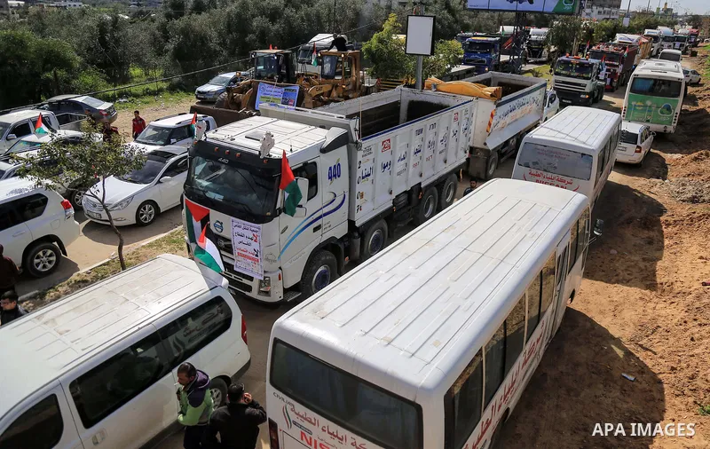 Palestinian truck drivers take part in a protest against the siege on the Gaza Strip, at Erez crossing, in the northern Gaza Strip on February 14, 2018. Israel has maintained a siege on Gaza for a decade which it says is...