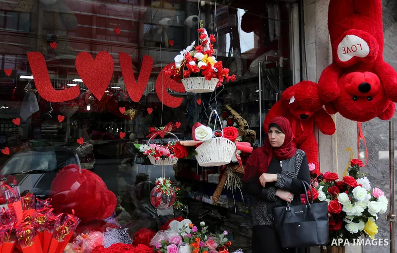 Palestinian vendors display flowers, red teddy bears, red ballons and pillows on Valentine's day in Gaza city on February 14, 2018. Valentine's Day is increasingly popular in the region as people have taken up the custom...