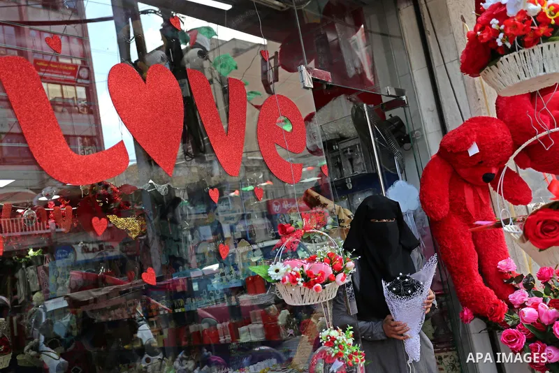 Palestinian vendors display flowers, red teddy bears, red ballons and pillows on Valentine's day in Gaza city on February 14, 2018. Valentine's Day is increasingly popular in the region as people have taken up the custom...