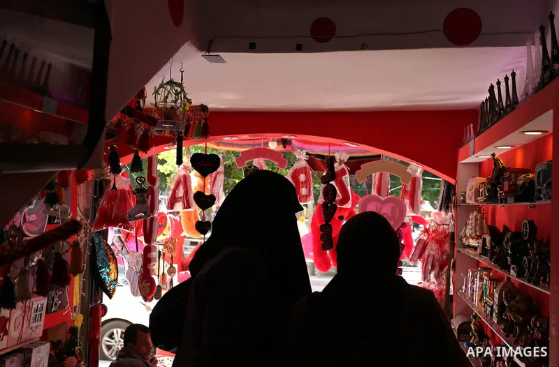 Palestinian vendors display flowers, red teddy bears, red ballons and pillows on Valentine's day in Gaza city on February 14, 2018. Valentine's Day is increasingly popular in the region as people have taken up the custom...
