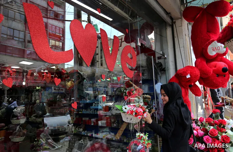 Palestinian vendors display flowers, red teddy bears, red ballons and pillows on Valentine's day in Gaza city on February 14, 2018. Valentine's Day is increasingly popular in the region as people have taken up the custom...