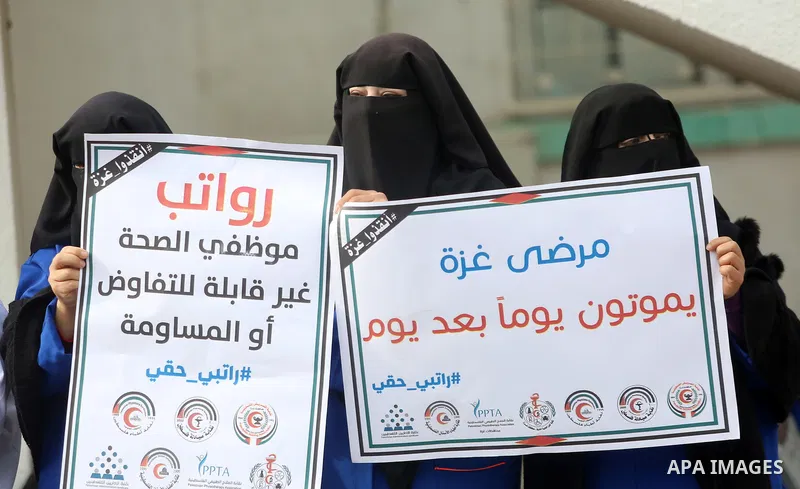 Palestinian employees of the Ministry of Health take part in a protest demanding their rights and against deterioration of health conditions, at al-Shifa hospital in Gaza City on February 15, 2018. Photo by Atia Darwish