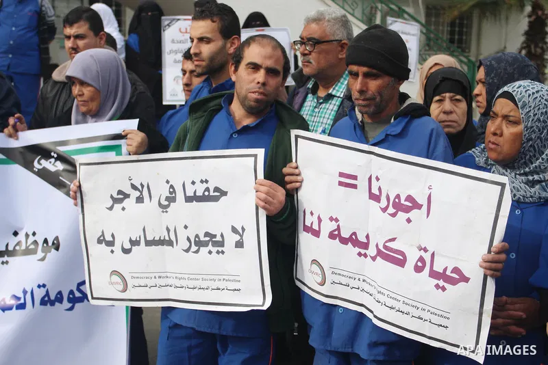 Palestinian employees of the Ministry of Health take part in a protest demanding their rights and against deterioration of health conditions, at al-Shifa hospital in Gaza City on February 15, 2018. Photo by Mahmoud Ajour