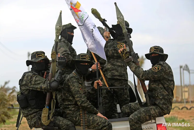 Palestinian Islamic Jihad militants take part in a military show in Khan Younis in the southern Gaza Strip February 15, 2018. Photo by Ashraf Amra
